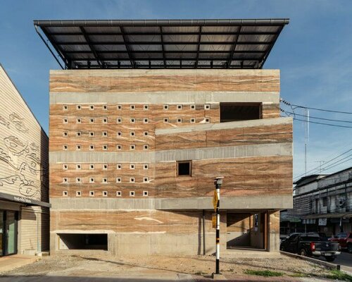 suphasidh architects completes rammed earth and concrete building in chonburi, thailand