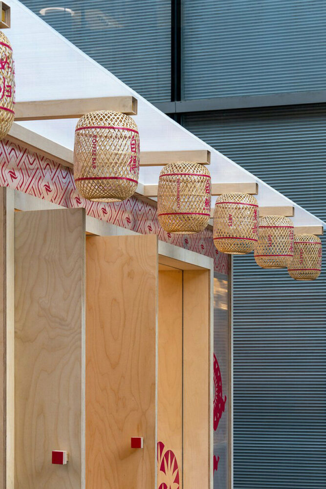 bamboo-woven lanterns ornament the exterior of the café