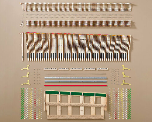 yamaha lines up and photographs the 8,000 parts that make up concert grand piano CFX