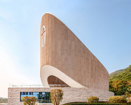 INUCE crowns julong mountain church in china with a sweeping ark-like nave