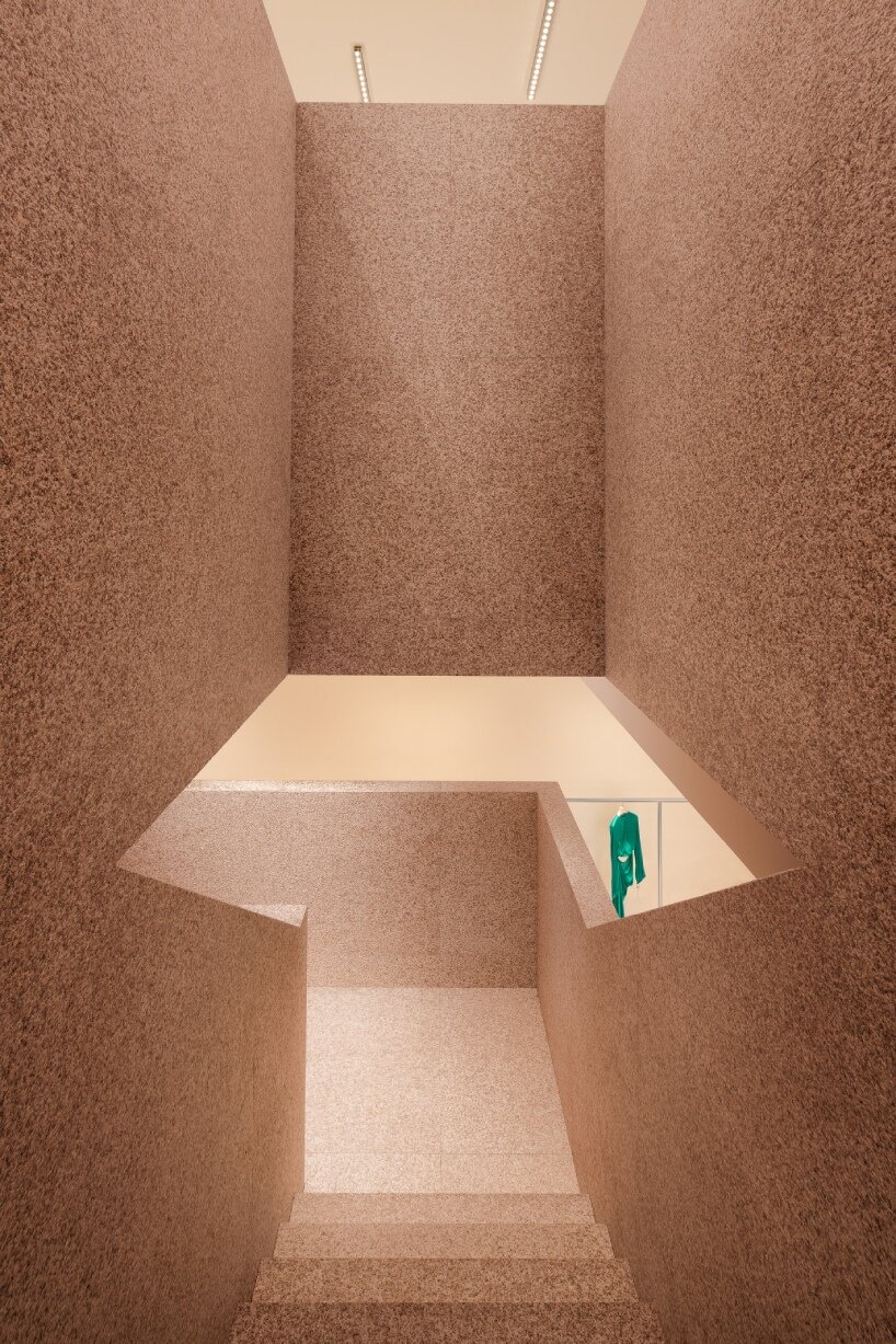 acne studios' signature flamed pink granite envelops beijing sanlitun flagship store