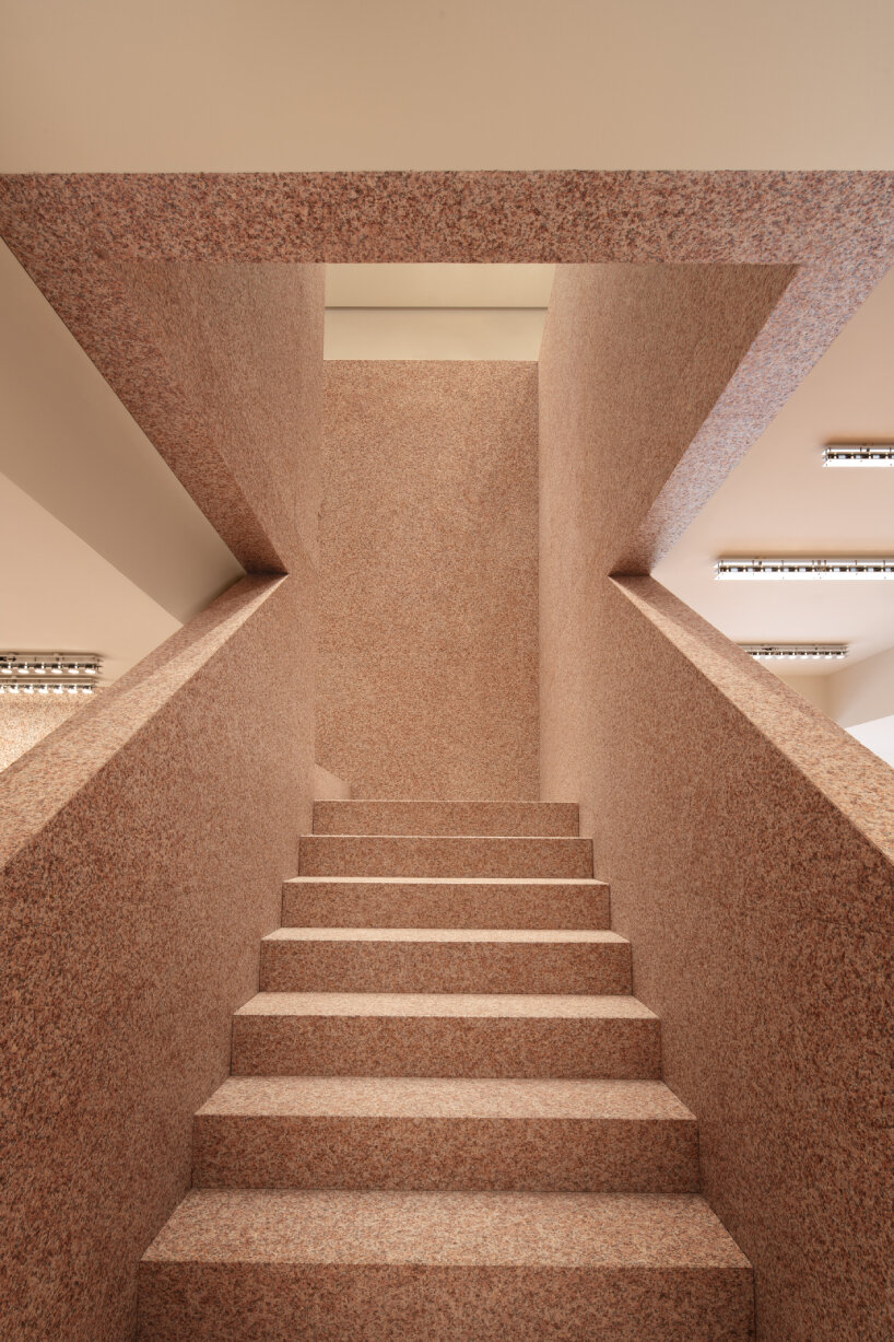 acne studios' signature flamed pink granite envelops beijing sanlitun flagship store