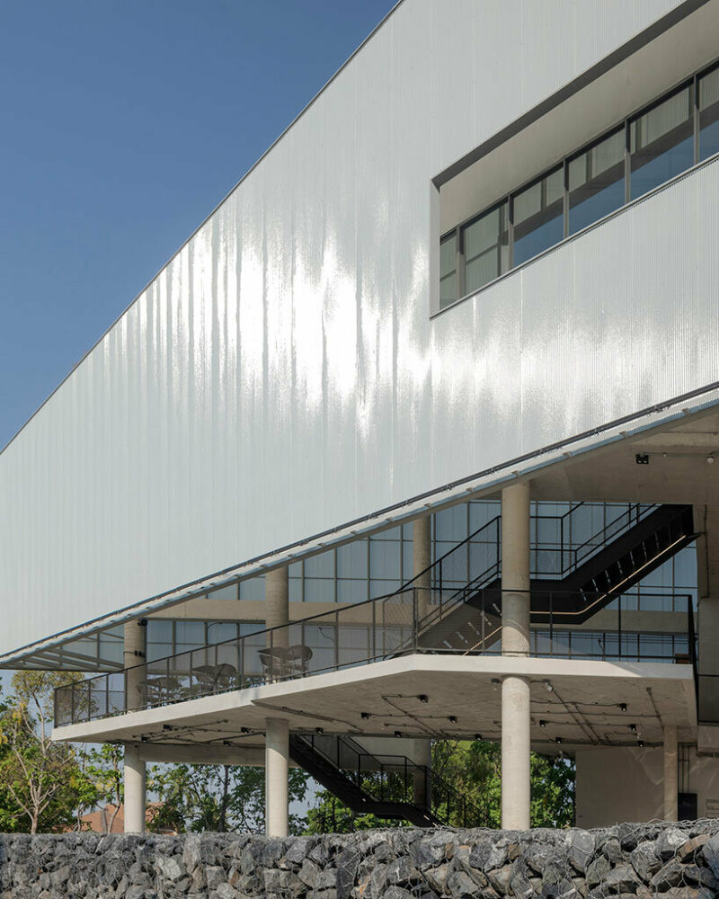 white translucent fiberglass roof tiles were applied to the facade