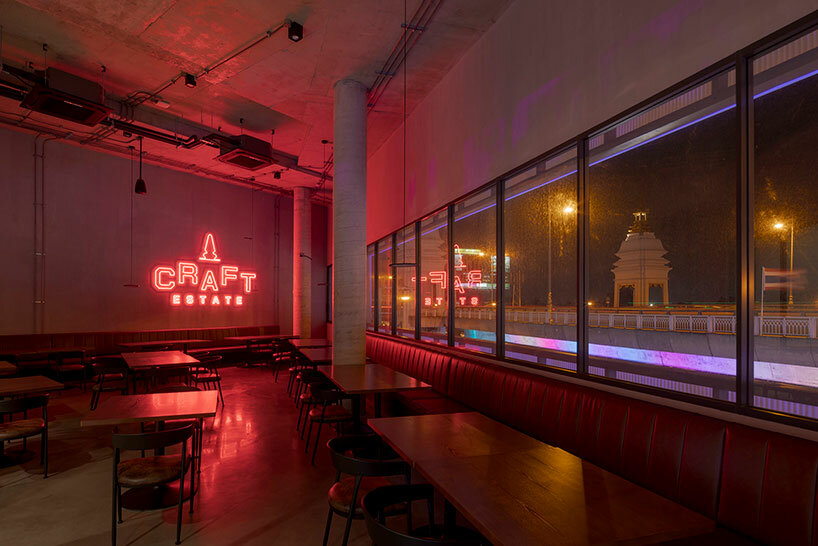 Craft Estate bar interior is bathed in red light at night