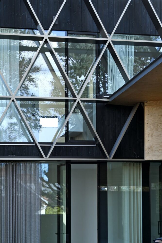 a metal mesh curtain on the ground floor enhances the facade's graphic quality