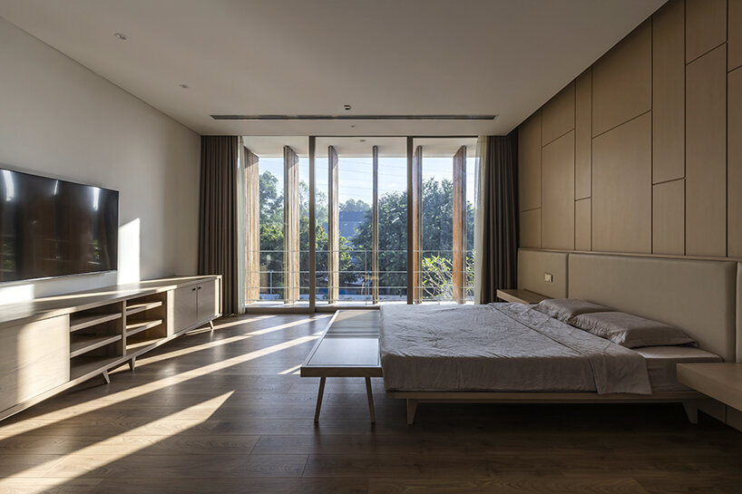 rotating bamboo shades regulate natural light in the bedroom