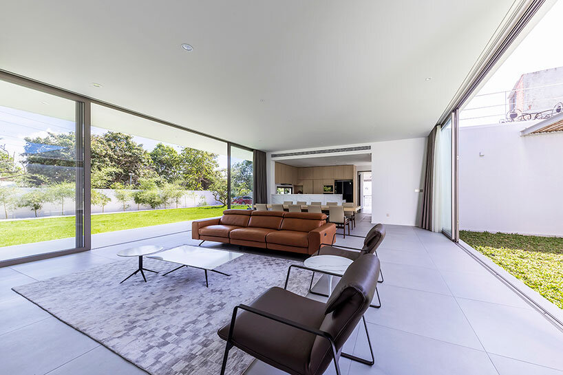 large glass floor-to-ceiling windows offer wide views of the garden 