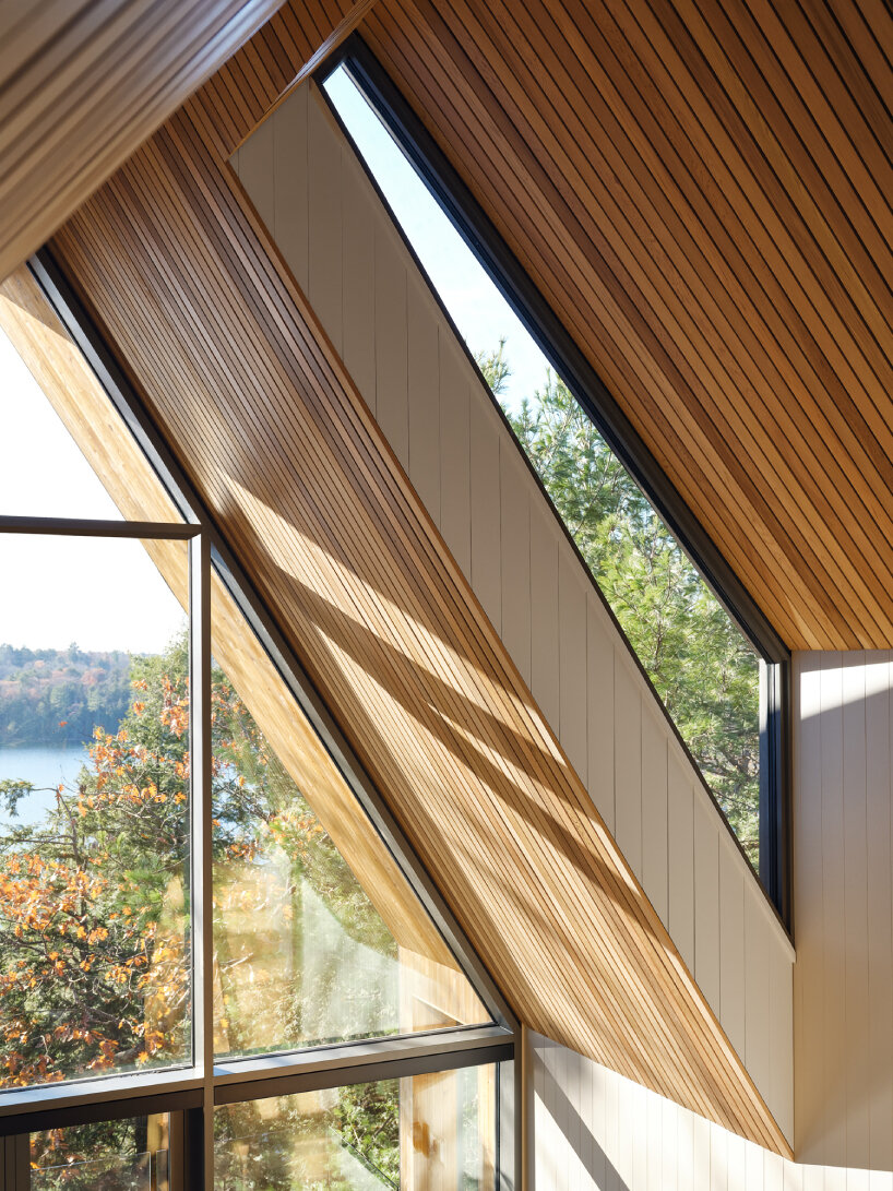 dubbeldam's rustic cottage in canadian woodlands unfolds across two split gables