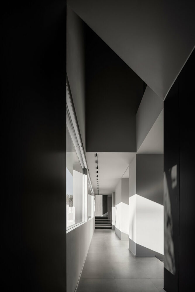 the shadowplay created by the combination of natural and artificial lighting creates a poetic ambiance in the building