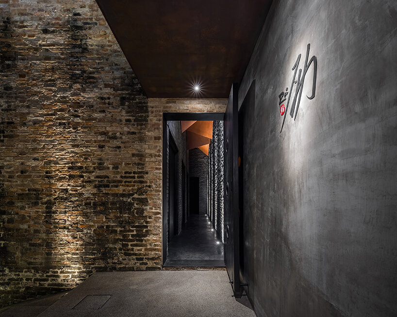 vermilion origami ceiling unfolds inside inrestudio's sushi restaurant in vietnam 