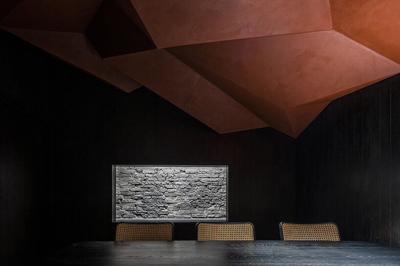 vermilion origami ceiling unfolds inside inrestudio's sushi restaurant in vietnam 