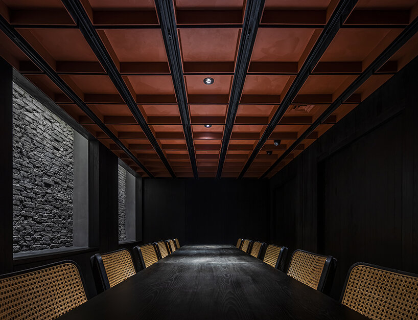 vermilion origami ceiling unfolds inside inrestudio's sushi restaurant in vietnam 