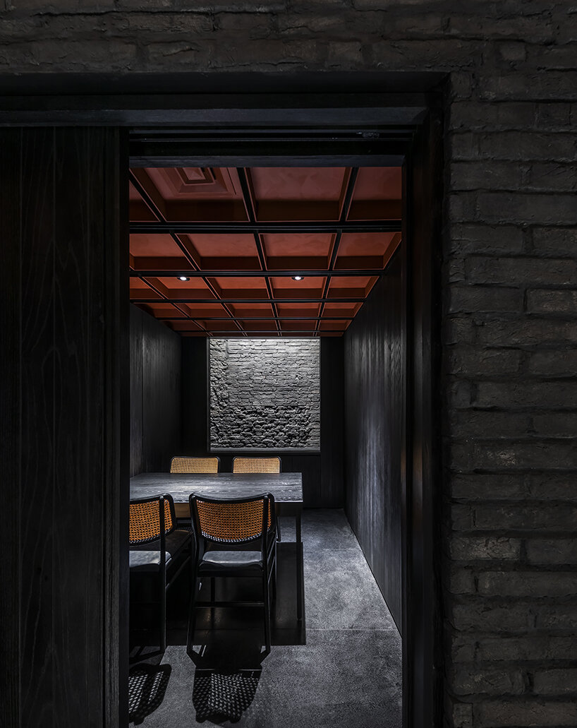 vermilion origami ceiling unfolds inside inrestudio's sushi restaurant in vietnam 