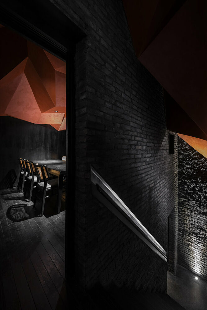 the origami ceiling leads the visitors from the entrance to the private rooms in the attic