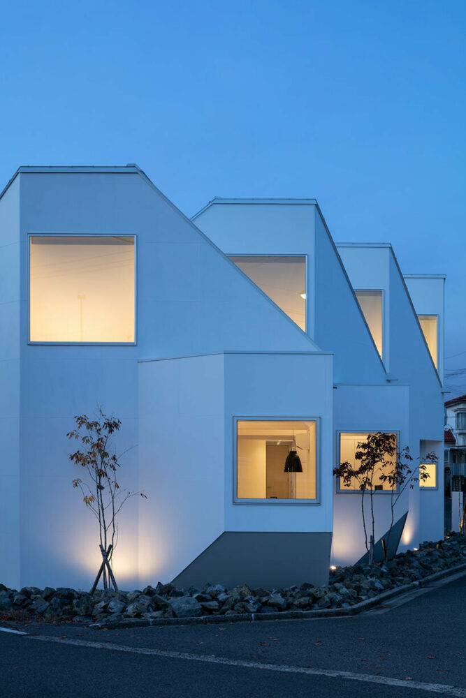 bay windows jut out at angles, framing views of the surrounding area