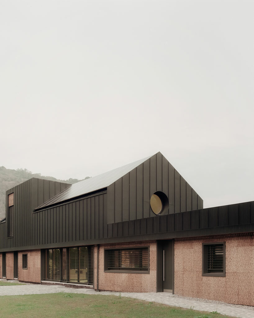 cork-covered border house by LCA architetti showcases sustainable solutions in italy