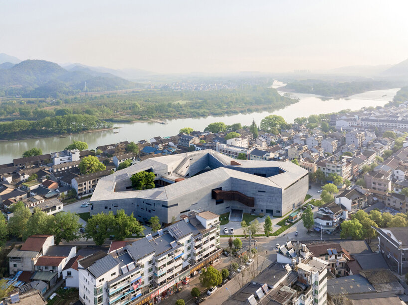 zhejiang lishui guyanhuaxiang art center by line+ spreads a fragmented ring formation