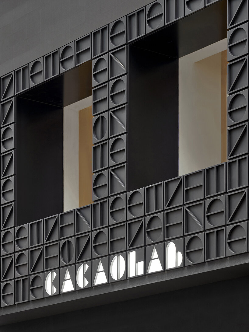 other projects' monogram facade conceals new-age cacaolab flagship store in hong kong
