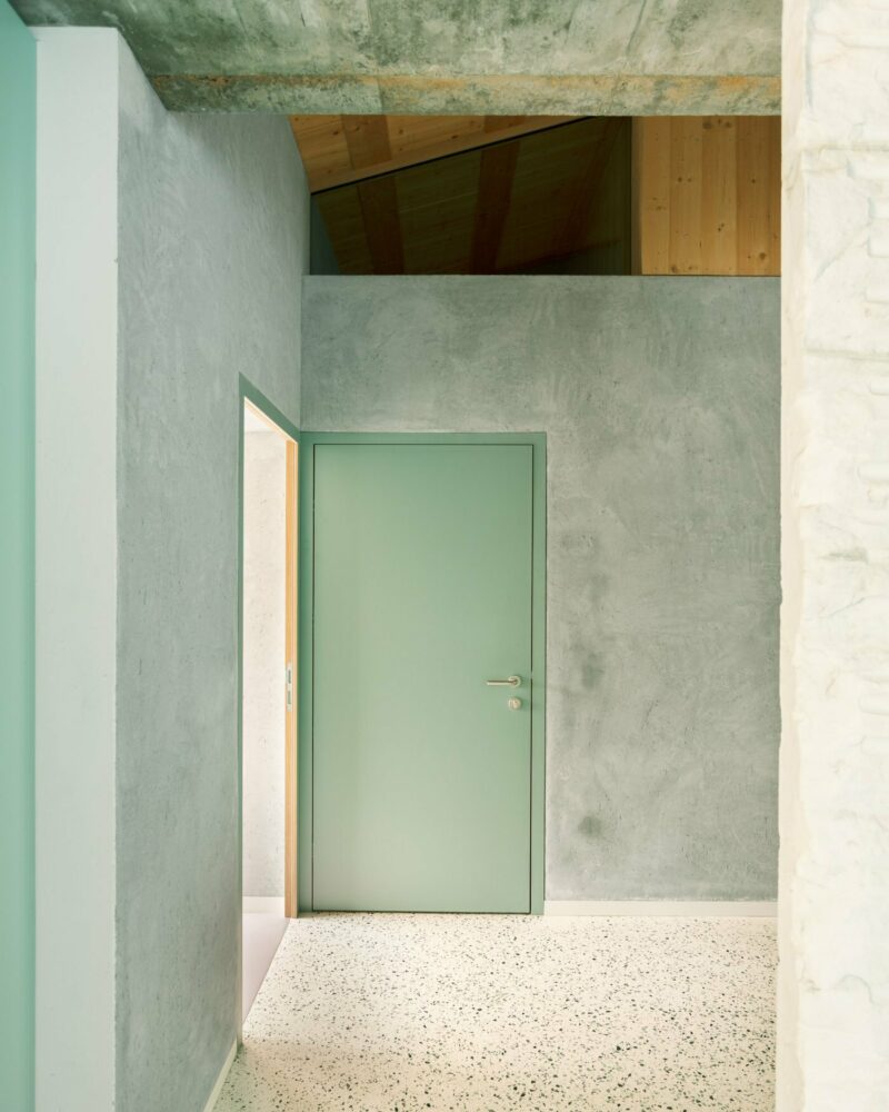 the second-floor apartment is accessed via the parking deck, with an interior staircase connecting to the downstairs floors