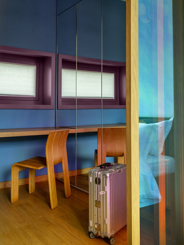 walk-in wardrobe connecting the bedroom to the bathroom