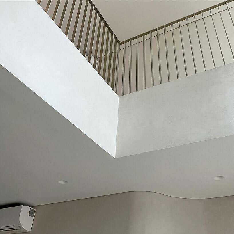 curved edges in internal walls echo the design of the facade