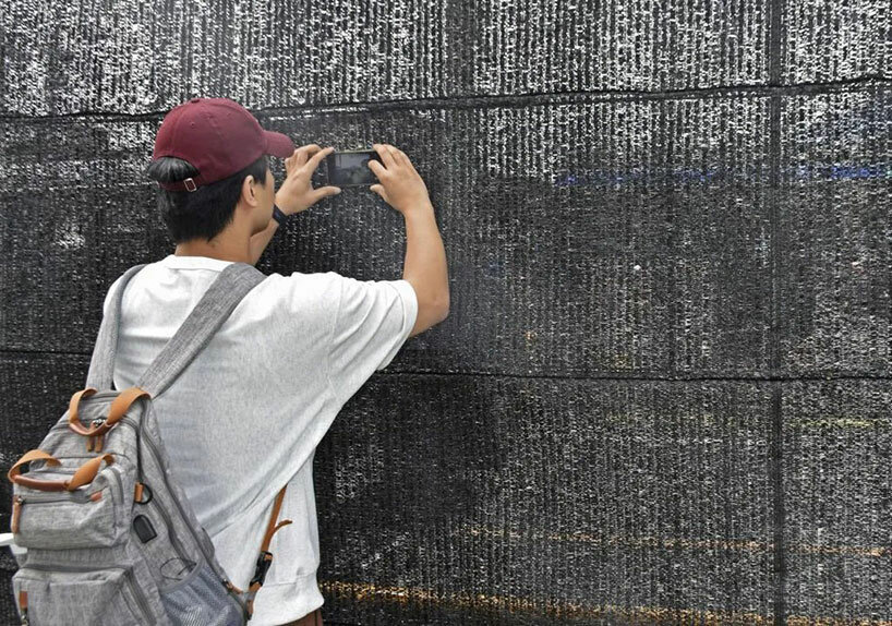 japan installs fence to protect mt. fuji, tourists poke holes to snap perfect photo