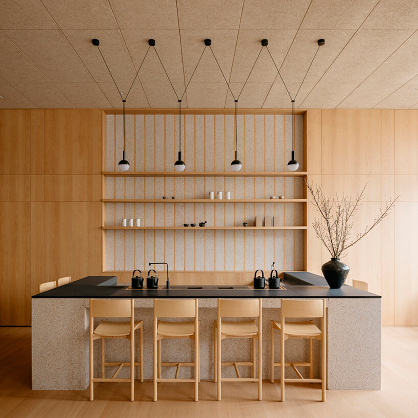 the Kongfu tea bar emphasizes the theatricality of the tea ceremony with a black slate counter