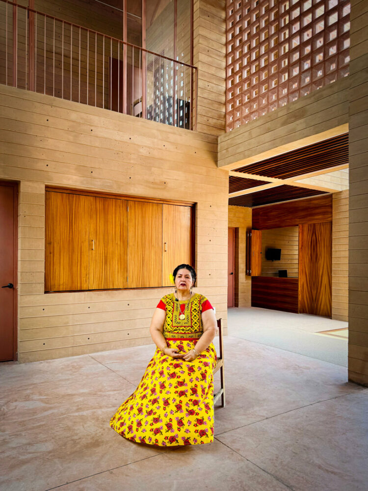 a double-height, semi-open, covered area functions as a flexible space for events