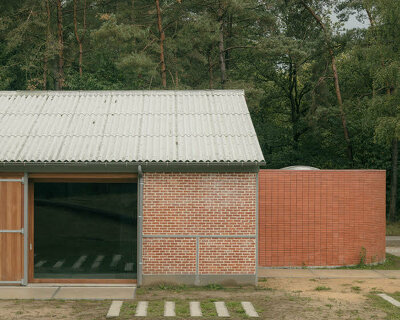 dmvA converts former belgian military sheds into contemporary youth center
