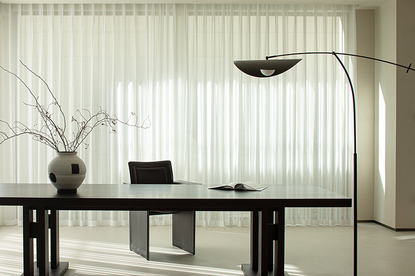 floor-to-ceiling glass allows natural light to enter