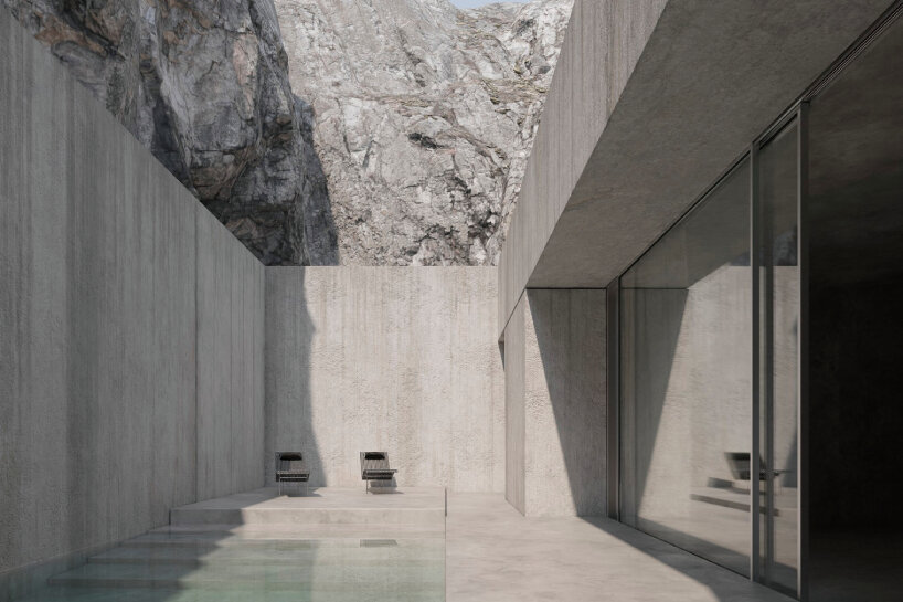 joão cepeda carves granite house into rugged cliffside in portugal - 1