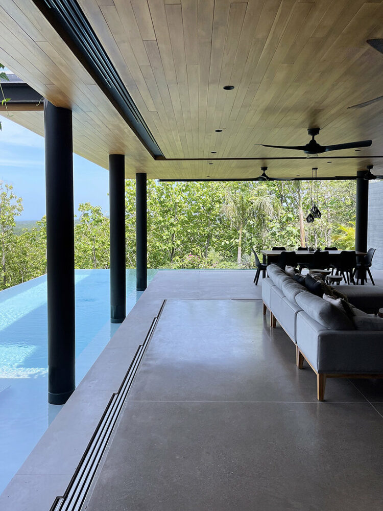 the living area opens onto terraces, blurring the lines between indoor and outdoor spaces