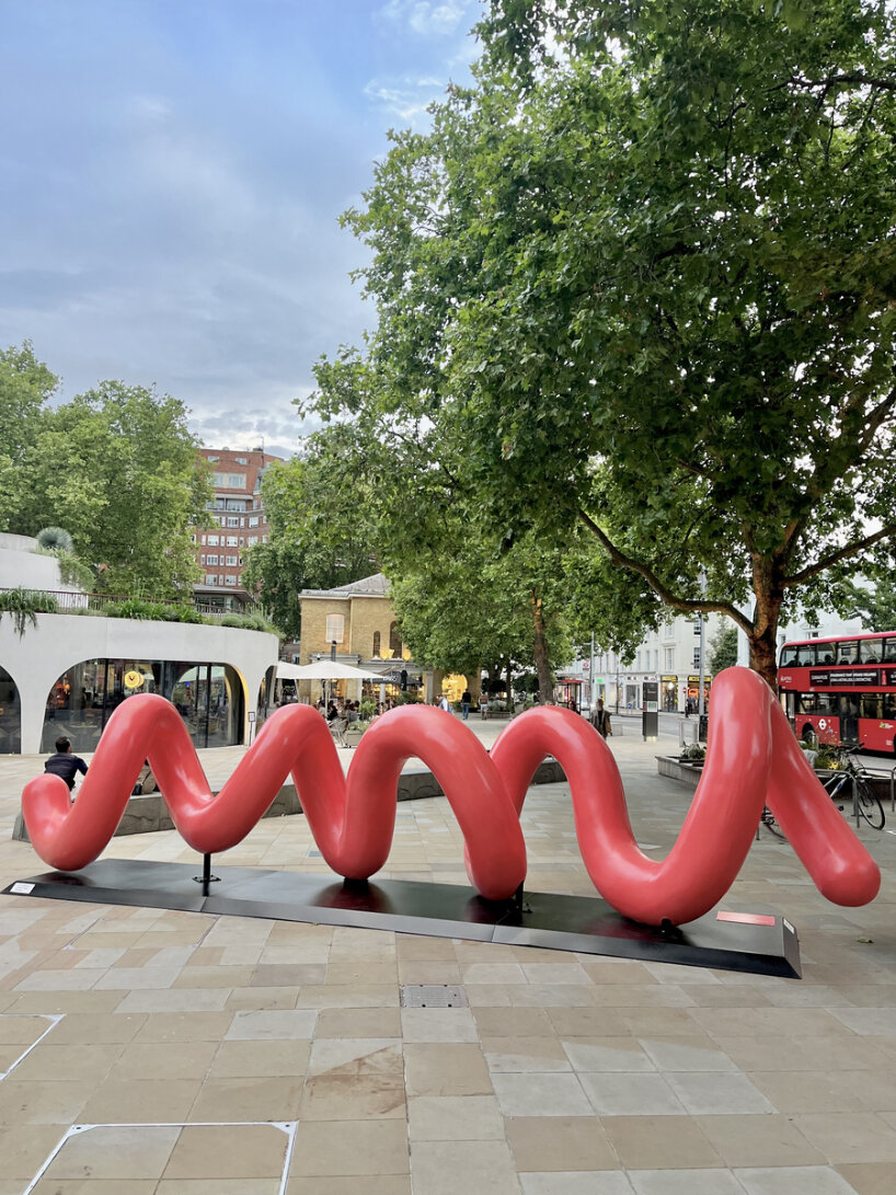 yoni alter's climbable, looping sculpture in london unravels to reveal the word 'love'