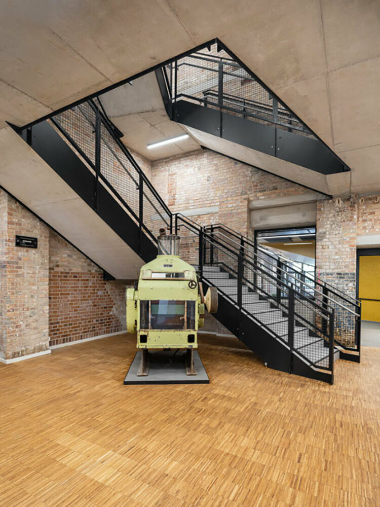 a central staircase connecting the old and new building wings