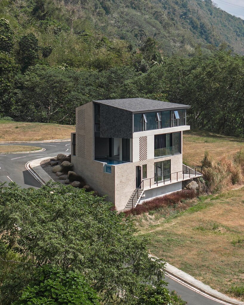 perforated adobe wall absorbs tropical heat to protect filipino residence