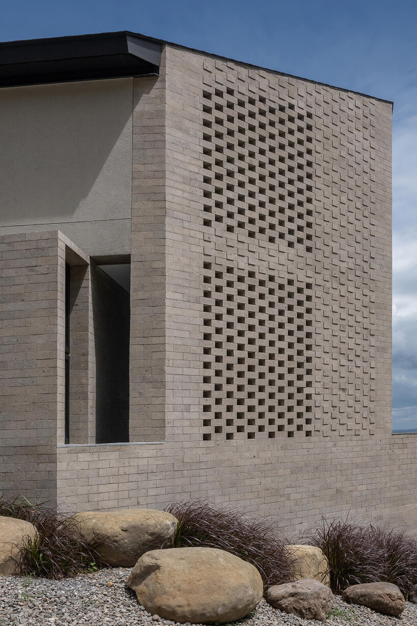 perforated adobe wall absorbs tropical heat to protect filipino residence