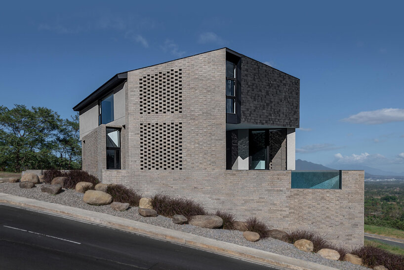 perforated adobe wall absorbs tropical heat to protect filipino residence