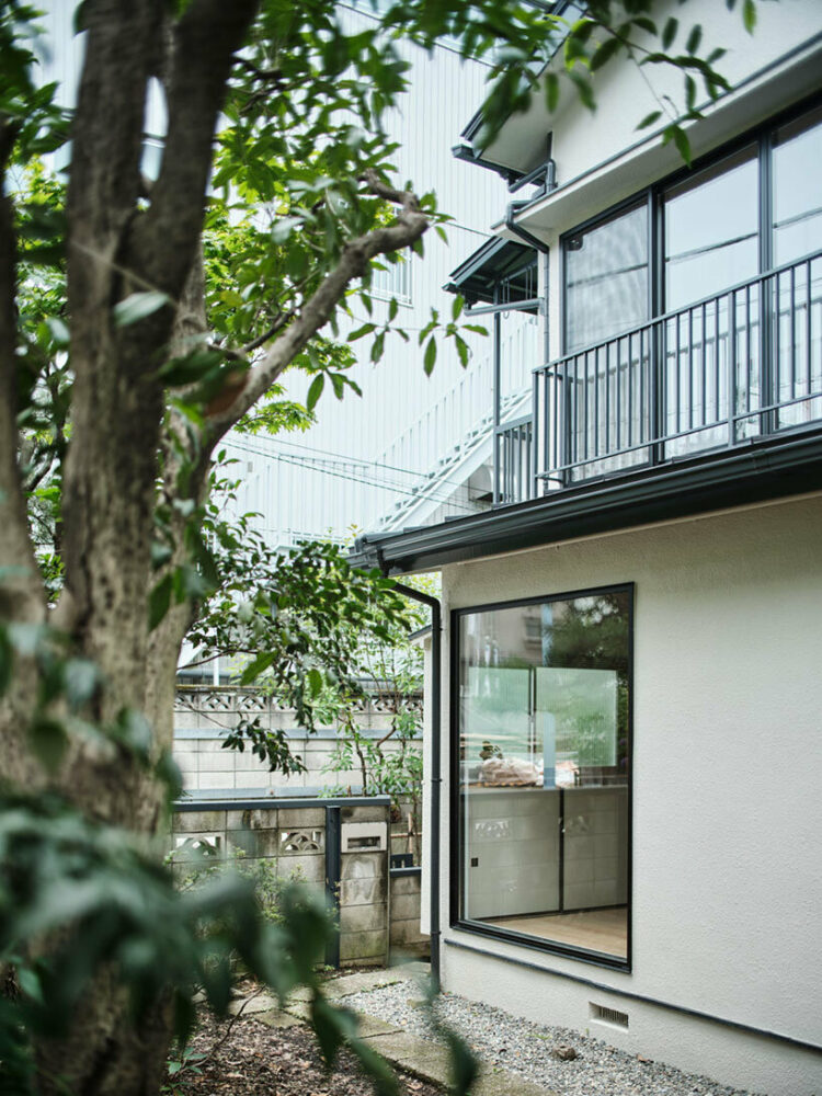 the wooden steps leading from the living room to the garden are replaced with traditional stone steps