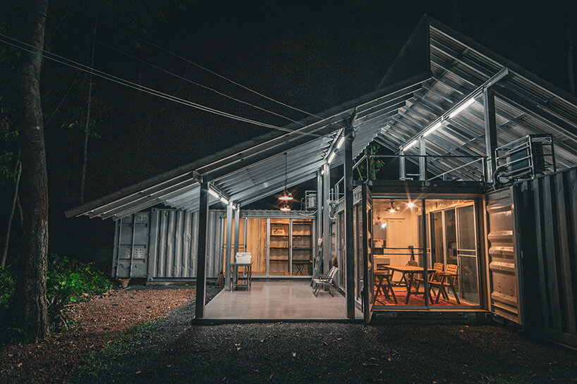 three six-meter-long containers are arranged without disturbing existing trees