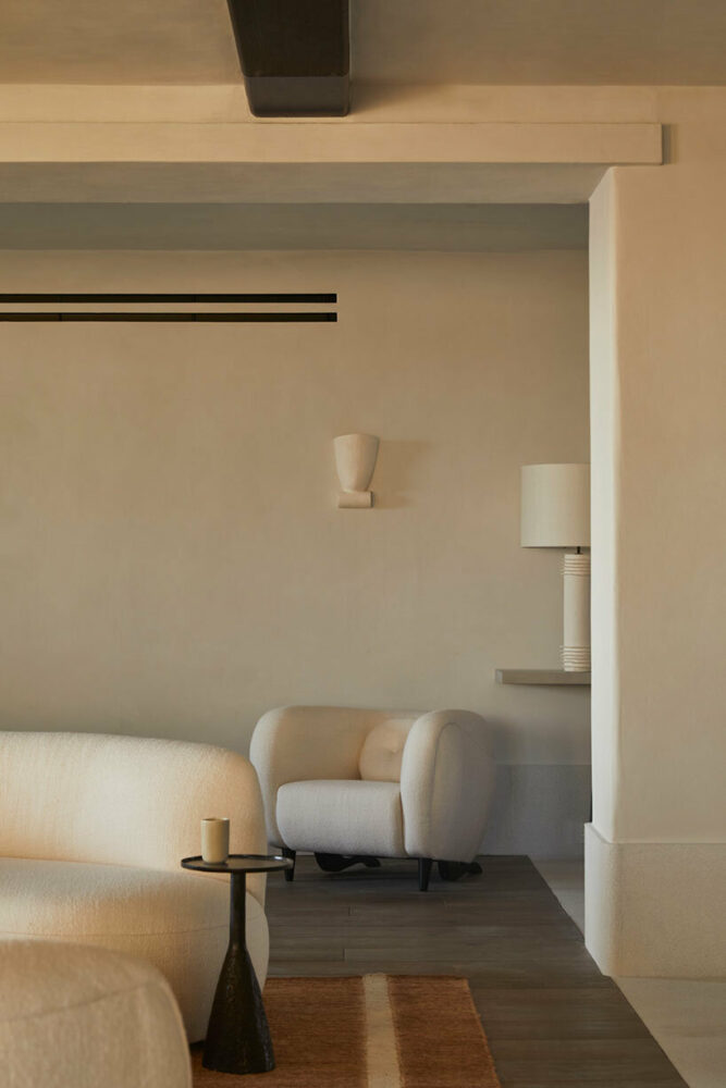 guests entering the hotel are welcomed by custom light fixtures from French sculptor Philippe Anthonioz