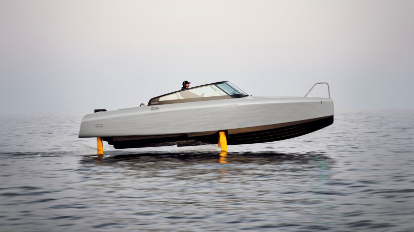 side profile of the Candela C-8 Polestar electric boat with gold hydrofoils