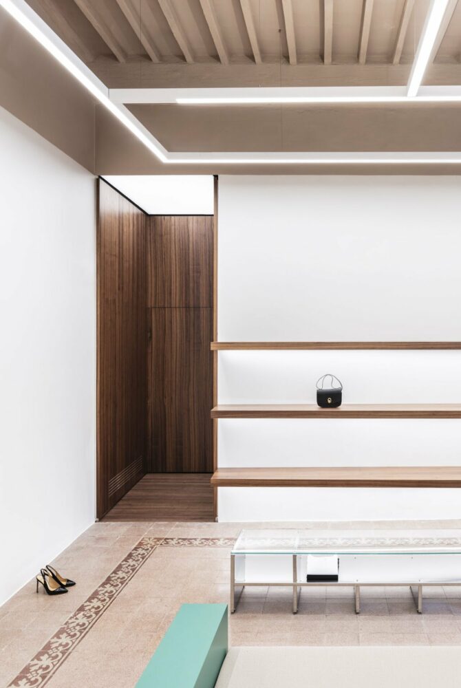highlighted by wood and steel materials the passages contrast with the original finishes