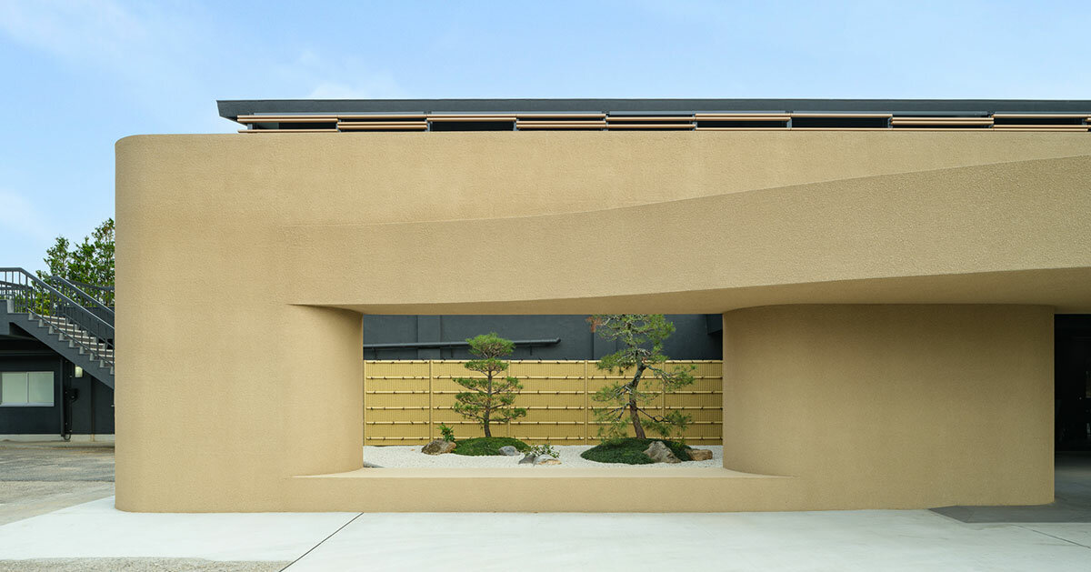 kubo tsushima architects sculpts earthy curved facade for