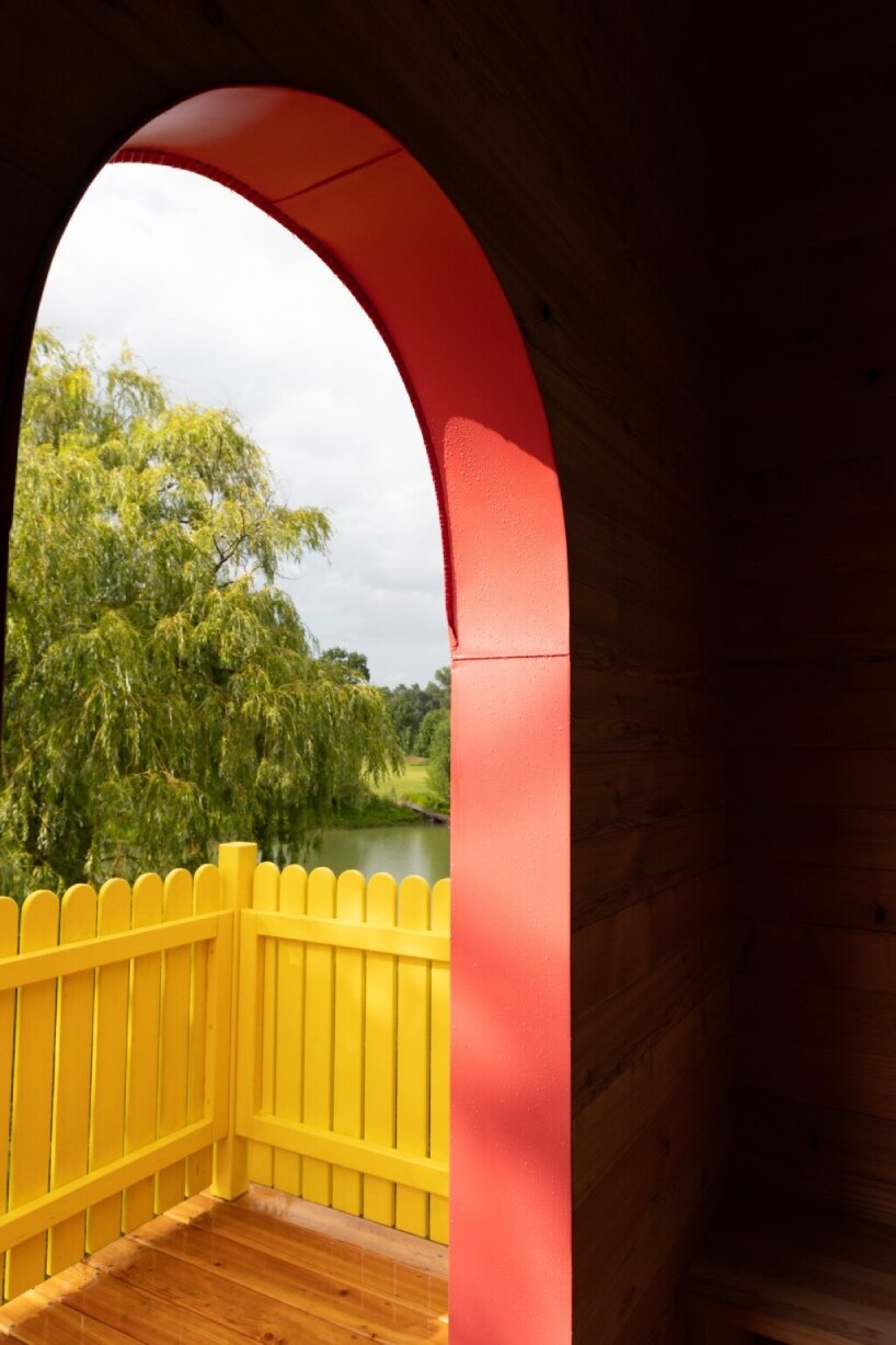 wrapped in wooden shingles, kollektiv plus x's cloud-shaped cyclist shelter ascends to views over iron curtain