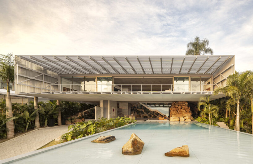 with a suspended infinity pool, tetro architecture's ponte house hangs from the hillside in brazil