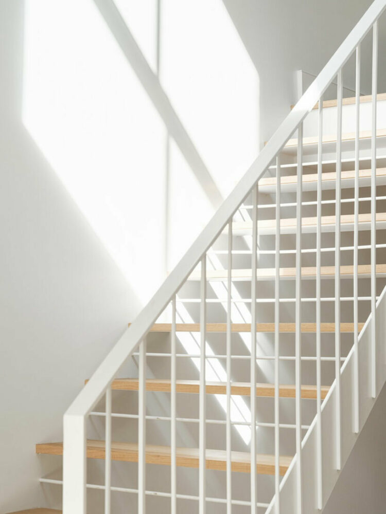 a bespoke metal staircase leads from the mezzanine to the rear extension