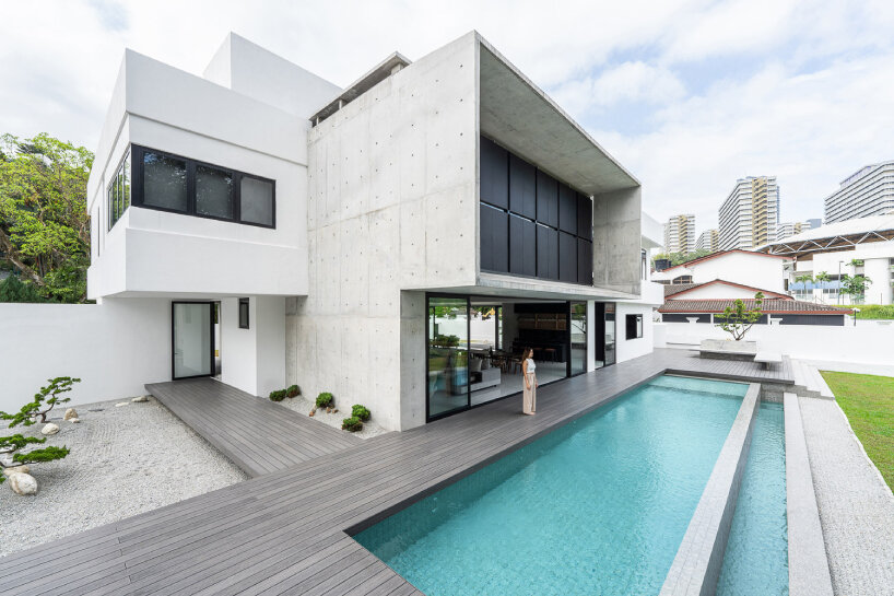 vast shuttered wall blurs thresholds at fabian tan's concrete house in kuala lumpur 