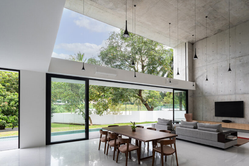 vast shuttered wall blurs thresholds at fabian tan's concrete house in kuala lumpur 