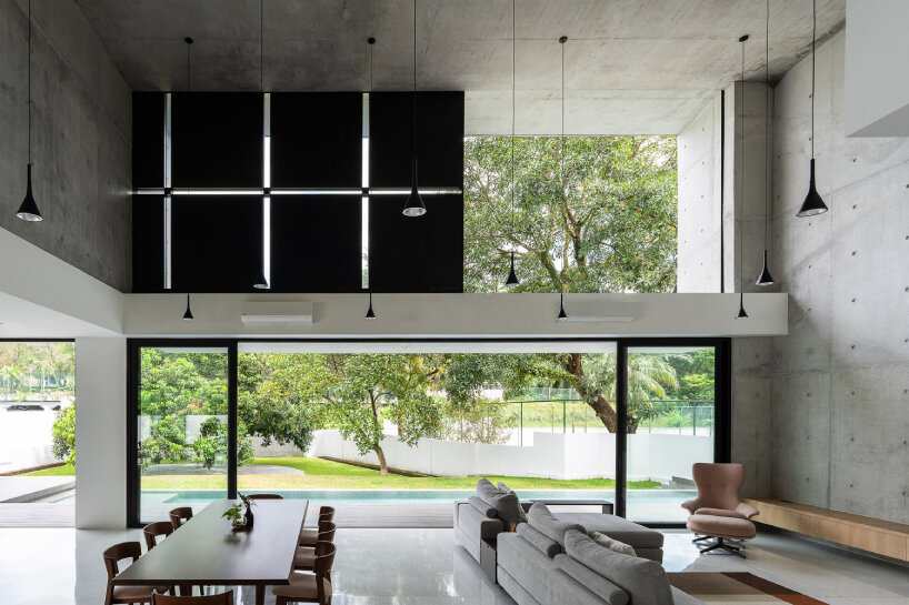 vast shuttered wall blurs thresholds at fabian tan's concrete house in kuala lumpur 