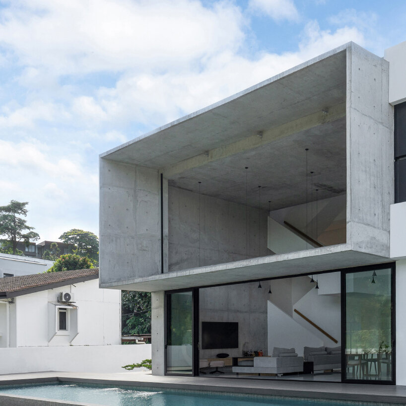 vast shuttered wall blurs thresholds at fabian tan's concrete house in kuala lumpur 